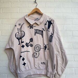 Vintage Beige Collared Graphic Sweatshirt with Black Tribal Icons